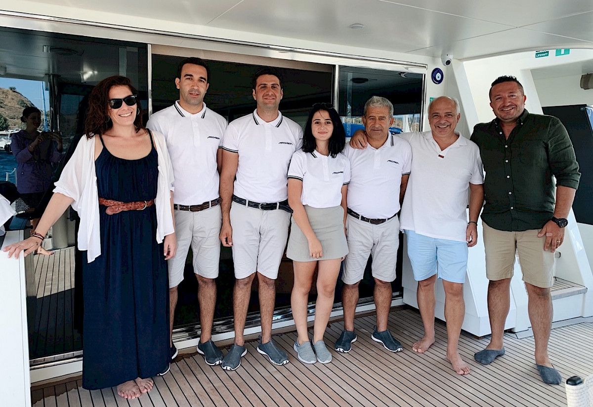 Motor yacht Archsea and the crew